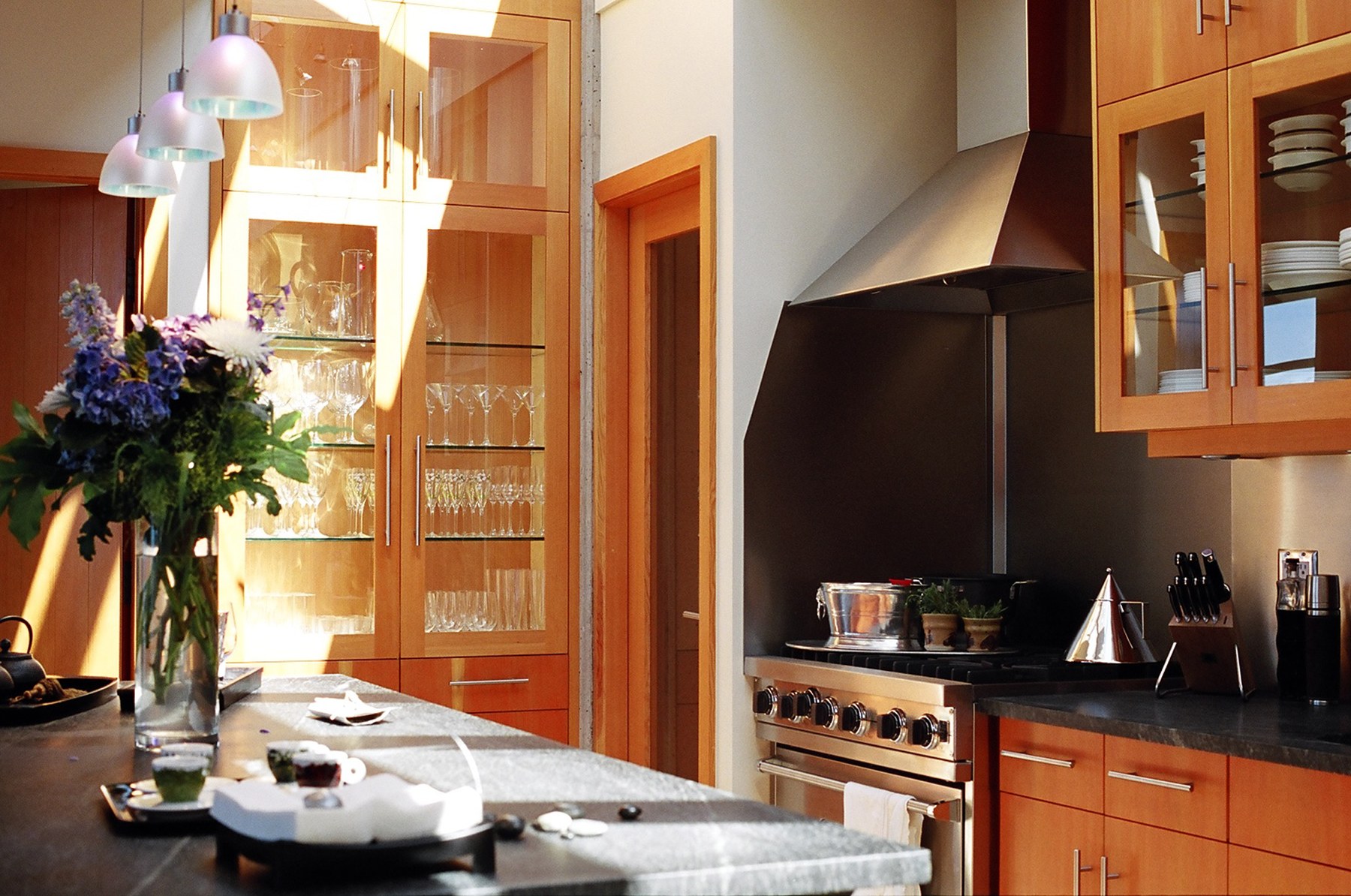 Kitchen fitted in clear-grain fir with stone counters