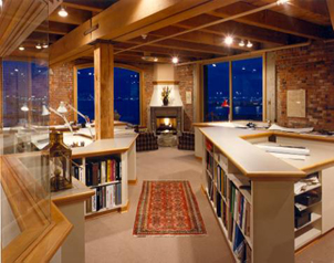 The working fireplace and seating group among the workstations