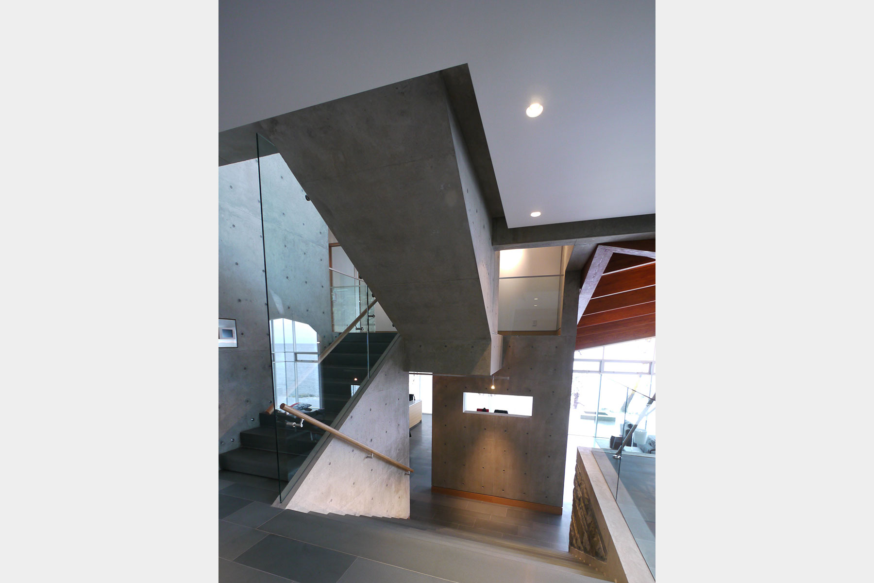 Concrete stair void with fir ceiling